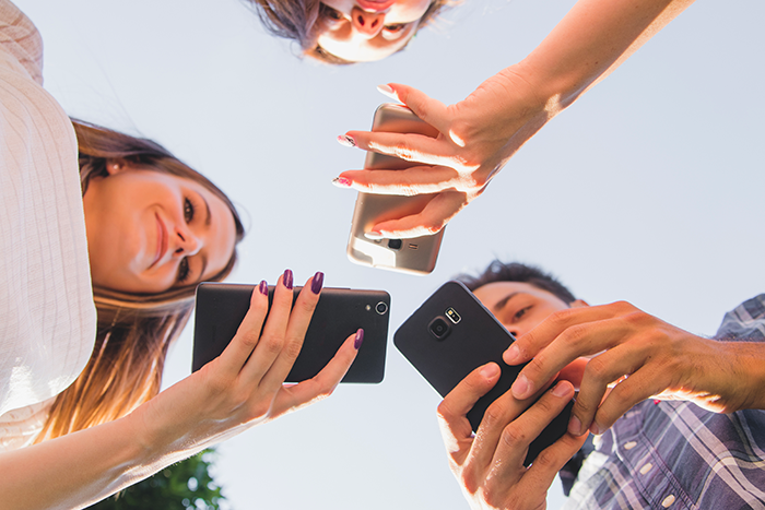 Youngsters with mobiles